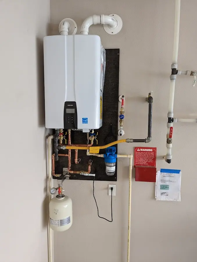 Professional plumber installing copper piping in a North Brooksville home